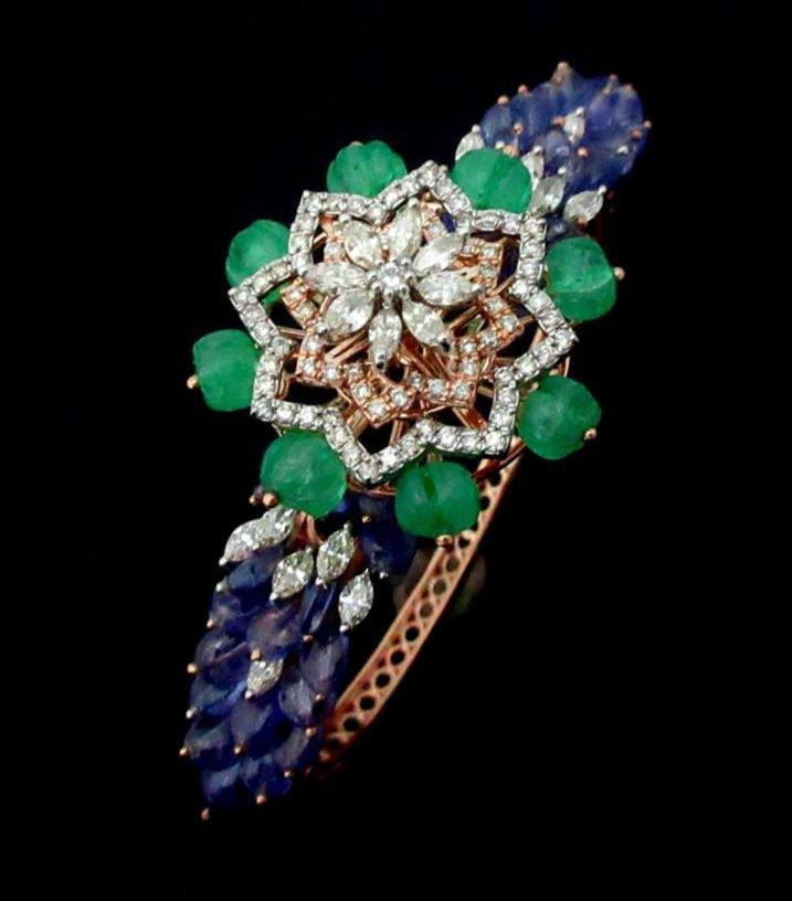 Vibrant diamond bracelet surrounded by saphhire and emerald beads set in timeless 14kt gold