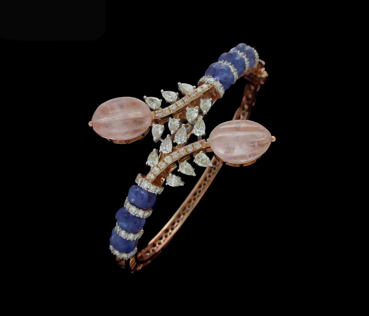Vibrant 14kt bracelet surrounded by sparkling fancy shape diamonds with combination of gemstones