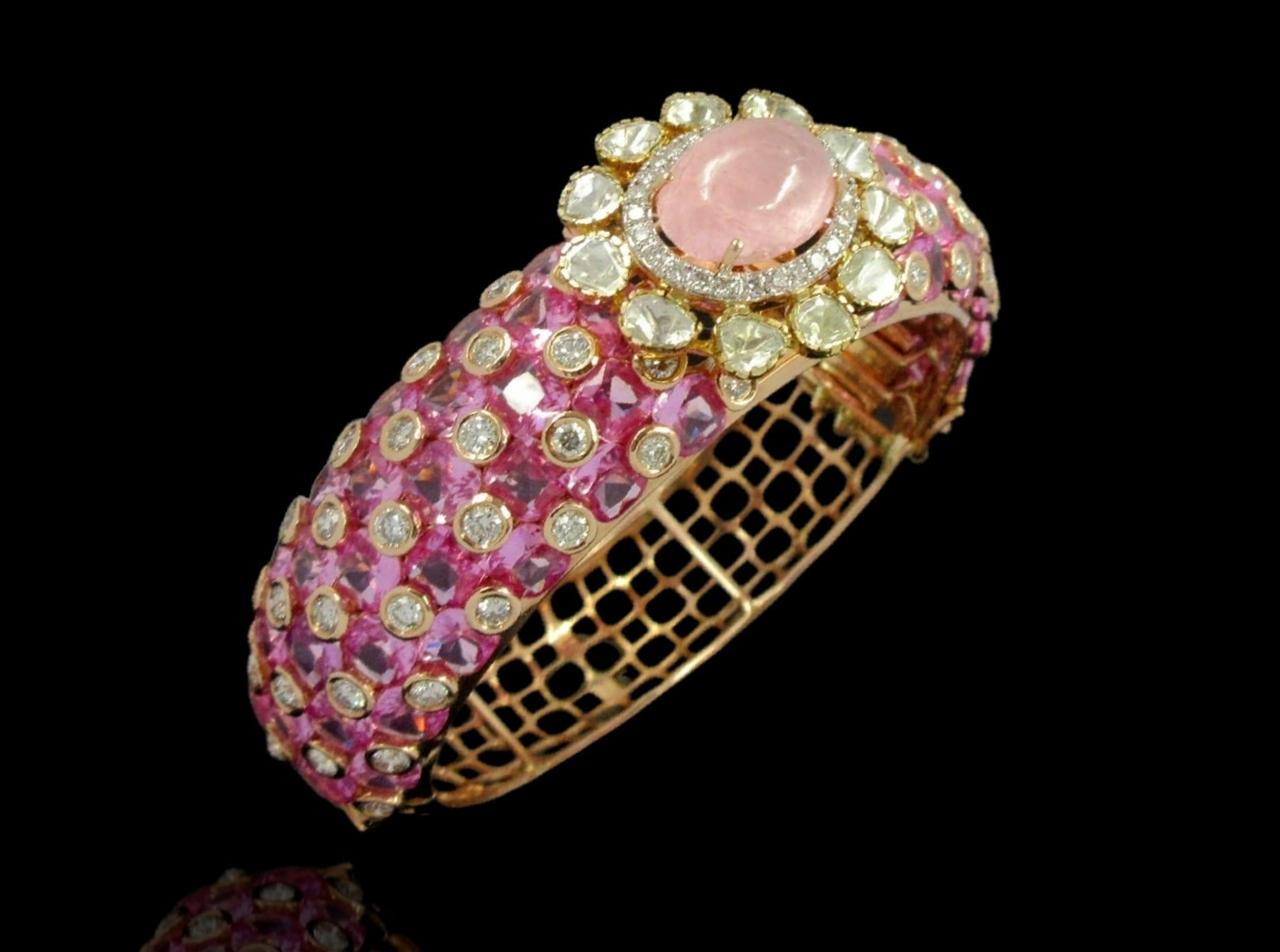 Vibrant 14kt bracelet surrounded by sparkling fancy shape diamonds with combination of gemstones