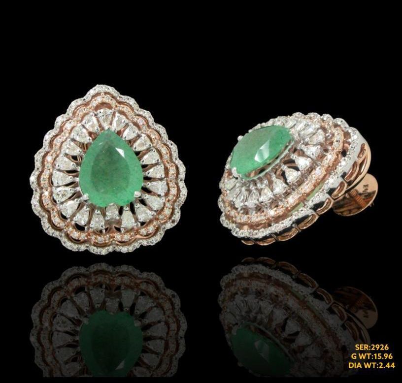 Stunning pair with brilliant fancy shape natural diamond encircling rich emerald in 14kt