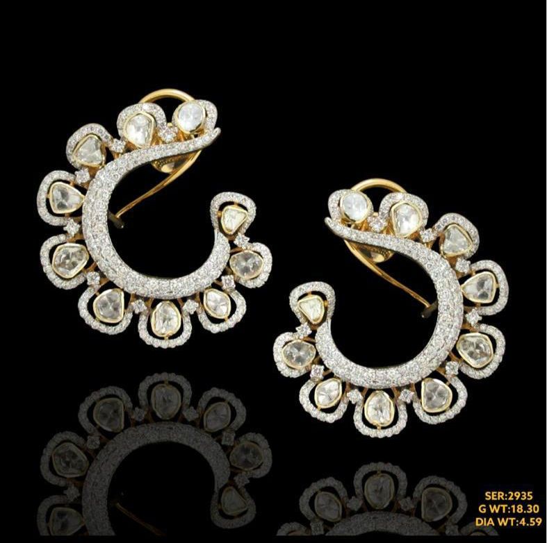 Vibrant pair of earrings studded with natural diamonds in 14kt for touch of sophistication