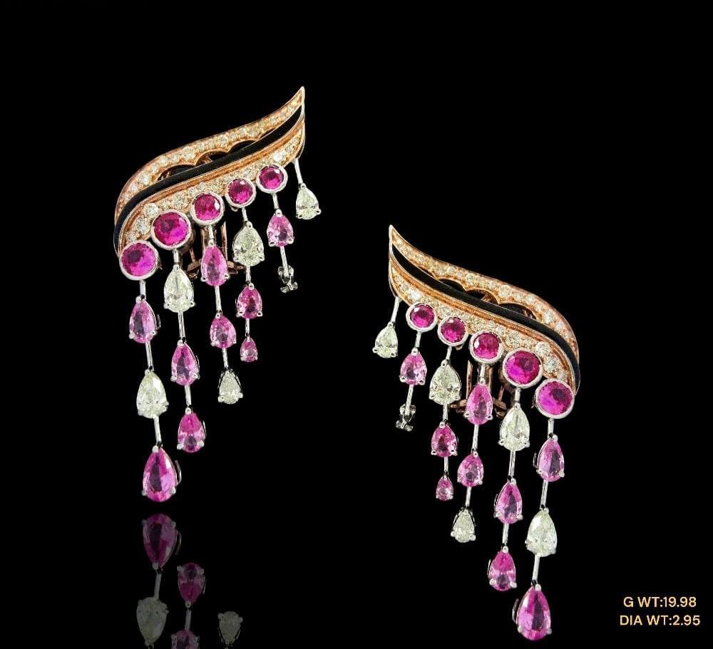 Stunning pair with brilliant natural fancy shape diamonds encircling a rich ruby all beautifully set in 14kt gold