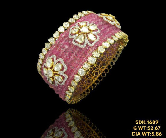 Classic 14kt gold bracelet with beautiful tourmaline enhanced by dazzling uncut diamonds and diamonds