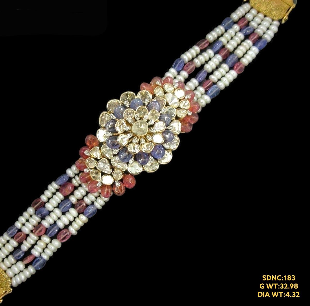 Elegant 14kt gold bracelet cum choker showcasing a radiant uncut diamonds with gem stone