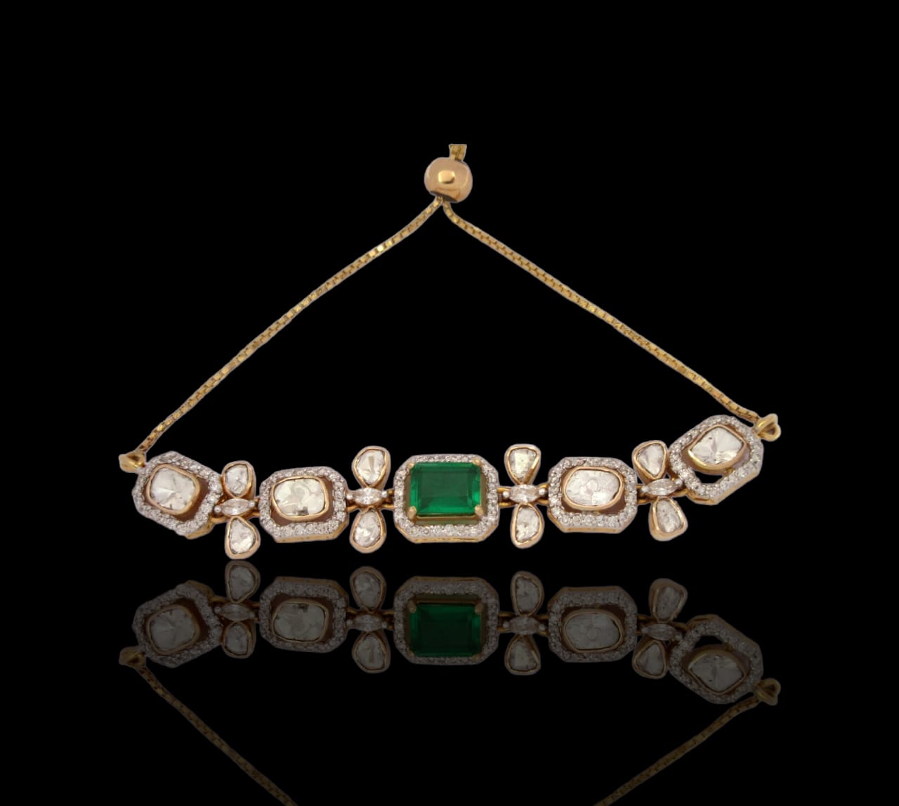 Classic 14kt gold bracelet with beautiful emerald, enhanced by dazzling uncut diamonds and diamonds