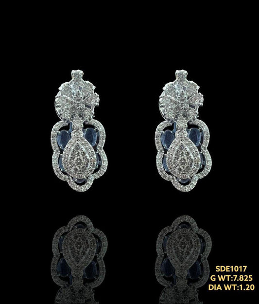 Elegant 14kt gold earing with tanzanite surrounded by sparkling natural diamonds